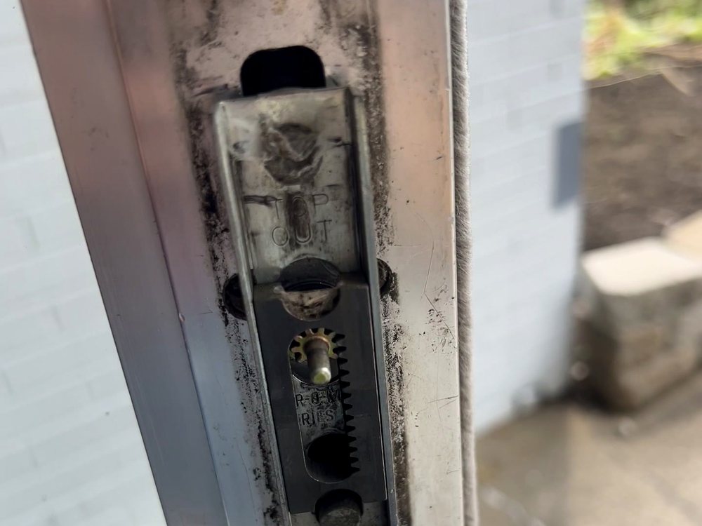 A commercial door lock being serviced on a call-out